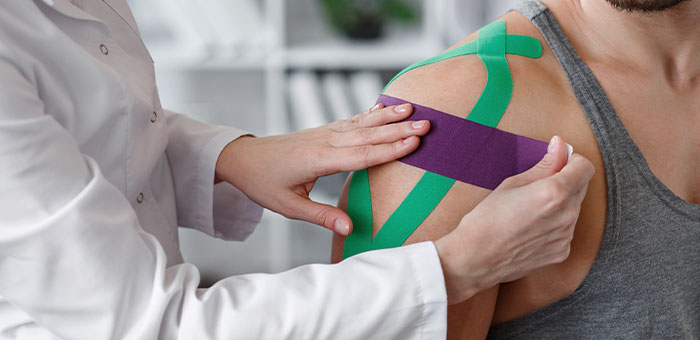 patient receiving kinesio taping in Irvine for auto accident injury