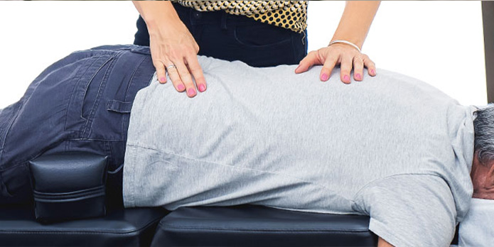 patient getting sacro occipital chiropractic in Irvine for auto accident injury